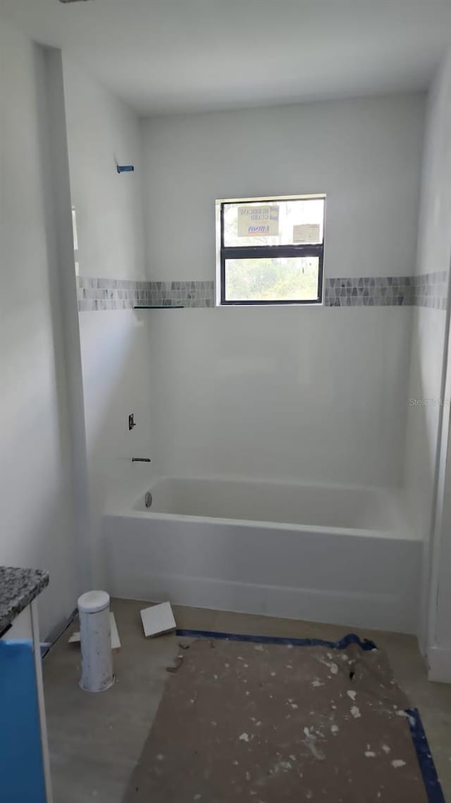 bathroom featuring vanity and shower / tub combination