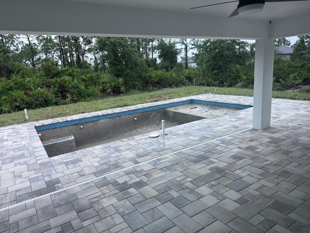 8285 Agate St, Port Charlotte, FL 33981 - view of pool with ceiling fan, an empty pool, and a patio