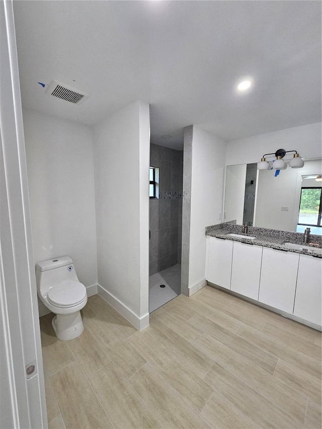 8285 Agate St, Port Charlotte, FL 33981 - full bathroom with walk in shower, double vanity, toilet, and baseboards
