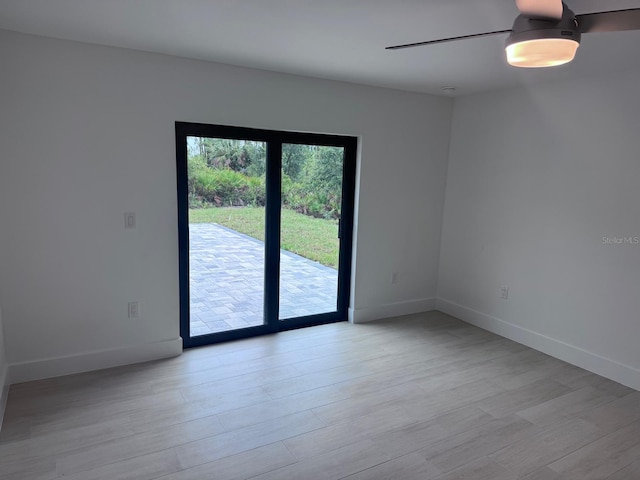 8285 Agate St, Port Charlotte, FL 33981 - empty room featuring wood finished floors and baseboards