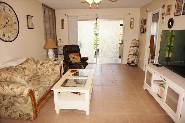 tiled living room featuring ceiling fan