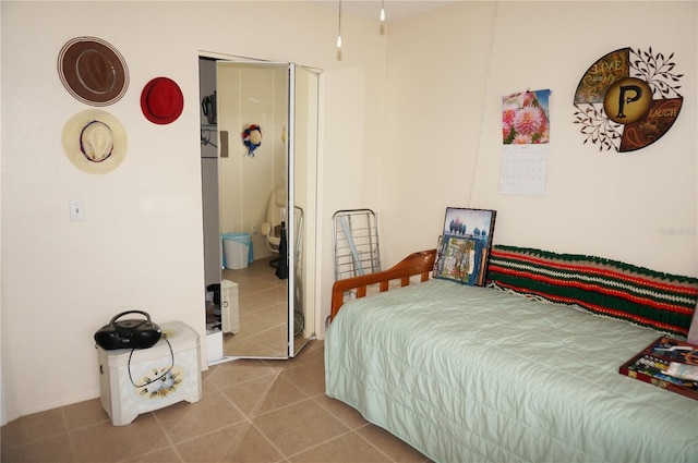 bedroom featuring light tile floors