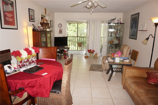 tiled dining area featuring ceiling fan