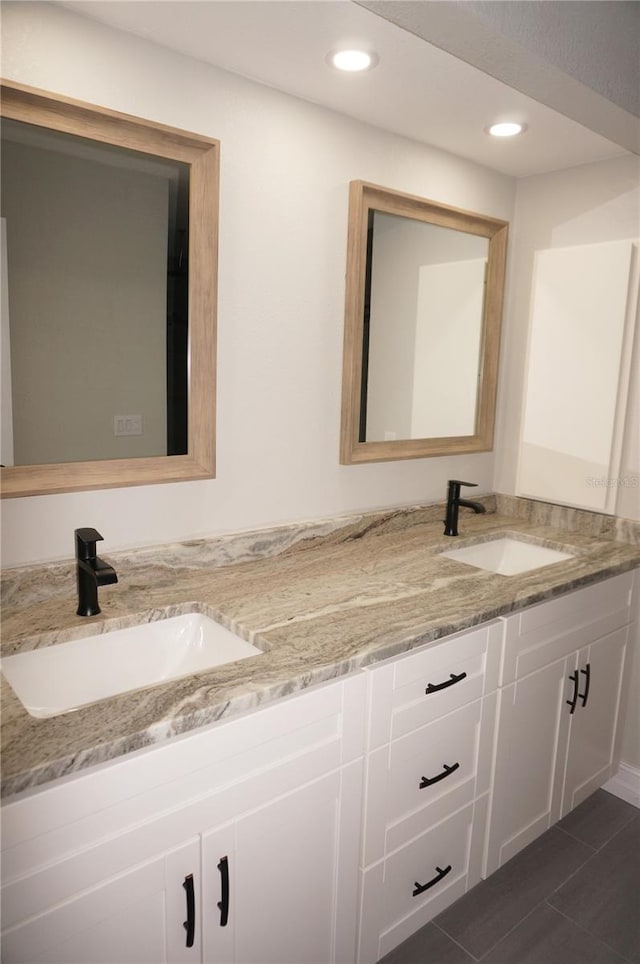 bathroom featuring dual vanity and tile flooring