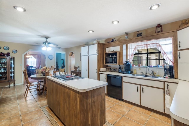 kitchen with light tile floors, ceiling fan, black appliances, and sink