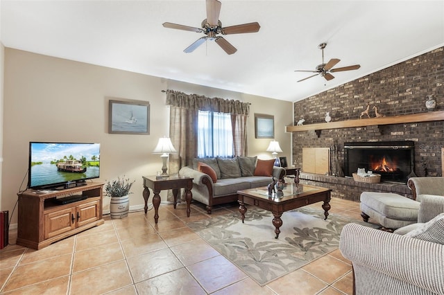 tiled living room featuring brick wall, lofted ceiling, ceiling fan, and a fireplace