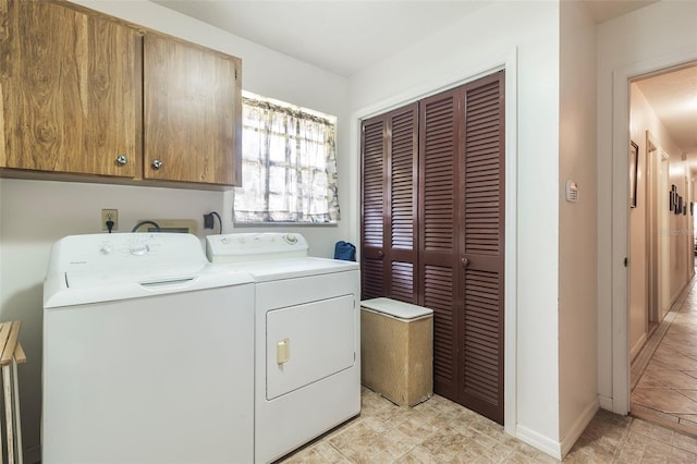 laundry area featuring washer hookup, light tile floors, hookup for an electric dryer, cabinets, and washer and clothes dryer