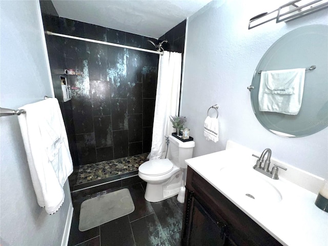 bathroom featuring tile floors, a shower with curtain, toilet, and vanity