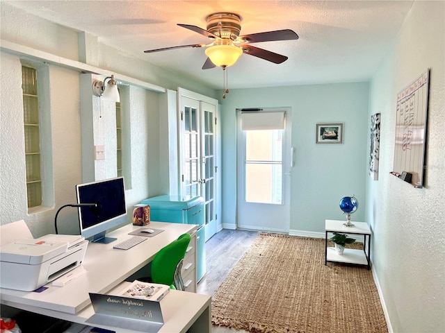 office area featuring ceiling fan and light hardwood / wood-style flooring