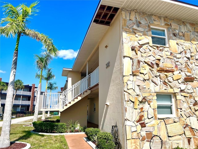 view of home's exterior with a balcony