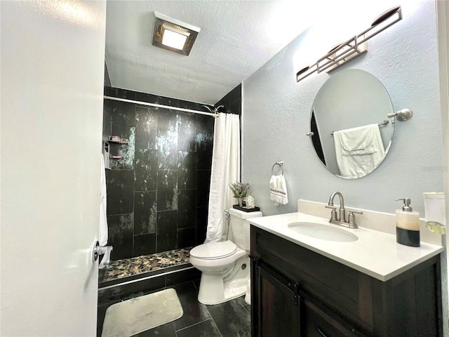 bathroom with a textured ceiling, tile flooring, a shower with curtain, vanity with extensive cabinet space, and toilet