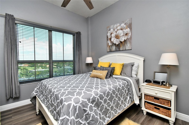 bedroom featuring ceiling fan and dark wood-type flooring