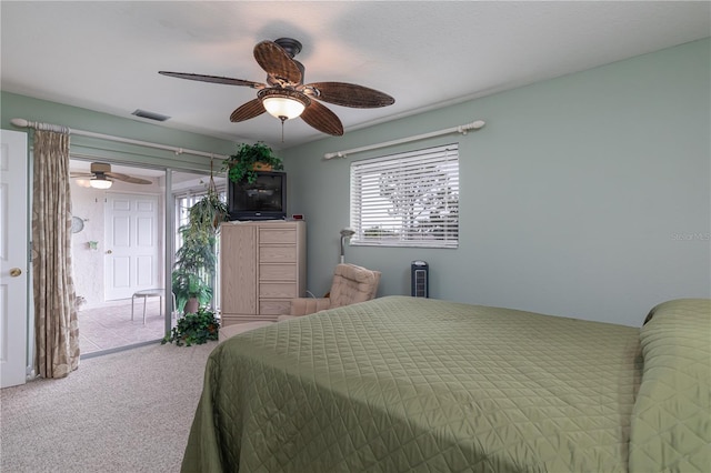 bedroom with ceiling fan, access to exterior, and carpet floors