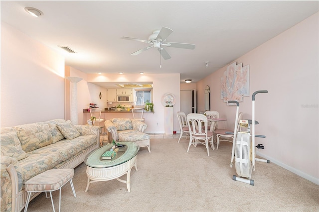 living room featuring ceiling fan and light carpet