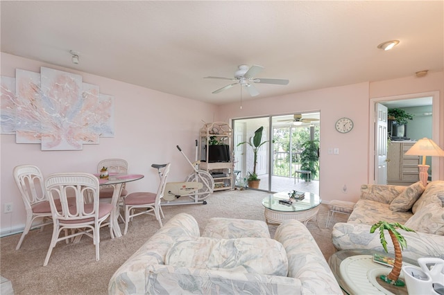 carpeted living room with ceiling fan