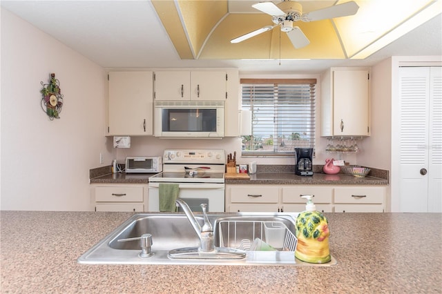 kitchen featuring ceiling fan, sink, and white electric range oven