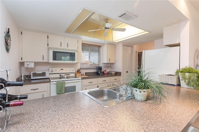 kitchen with kitchen peninsula, ceiling fan, white electric range, white cabinets, and sink