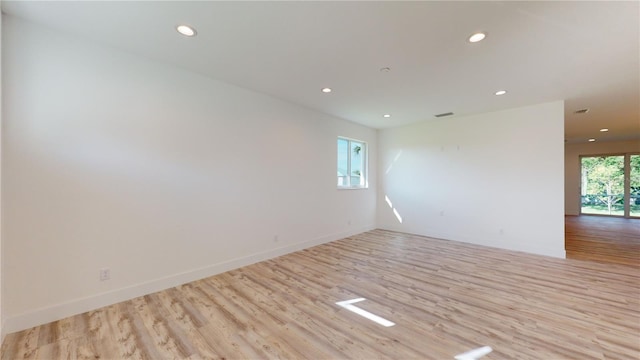 empty room with light wood-type flooring