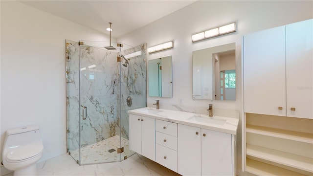 bathroom featuring vanity, toilet, and a shower with door