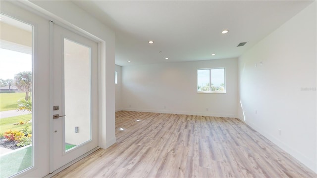 spare room with light wood-type flooring