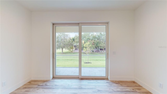 doorway to outside with light hardwood / wood-style floors