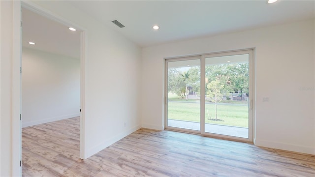 spare room with light wood-type flooring