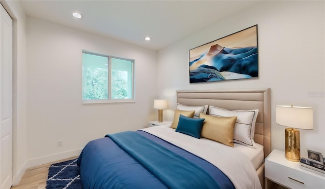 bedroom with light hardwood / wood-style floors