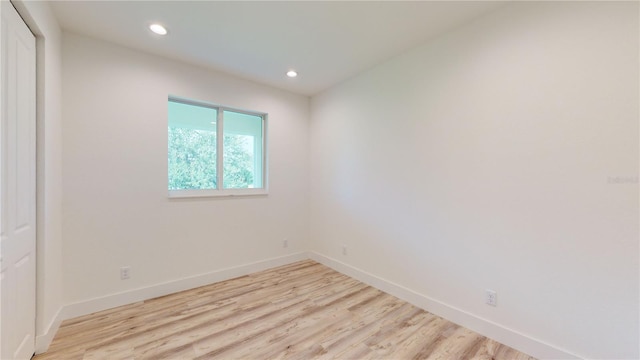 unfurnished room with light hardwood / wood-style flooring