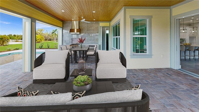 view of patio / terrace with ceiling fan and outdoor lounge area