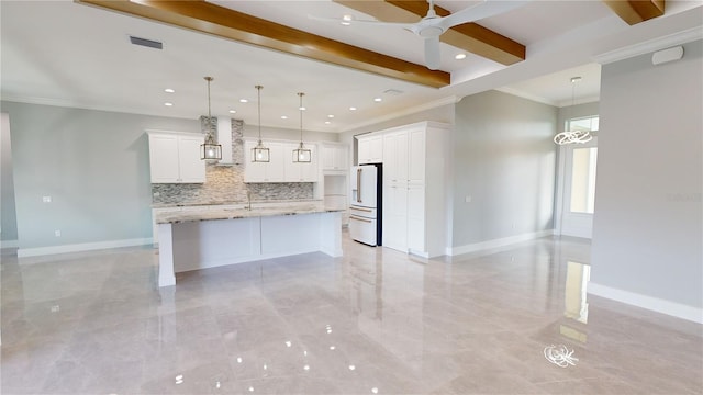 kitchen featuring white fridge with ice dispenser, a large island with sink, white cabinets, and decorative light fixtures