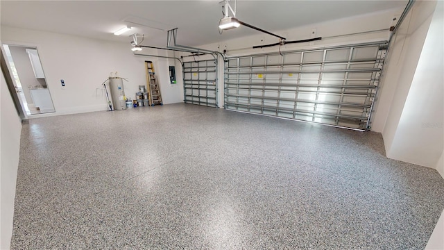 garage featuring electric panel, electric water heater, and a garage door opener