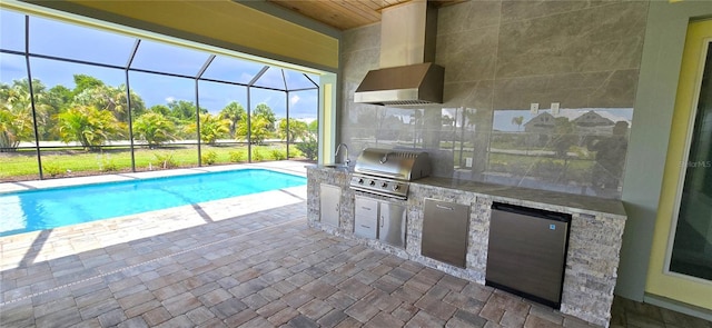 view of pool featuring glass enclosure, a patio area, a grill, and area for grilling