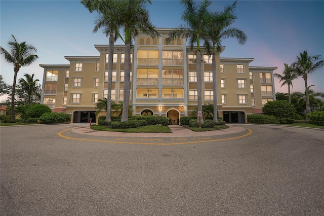 view of outdoor building at dusk