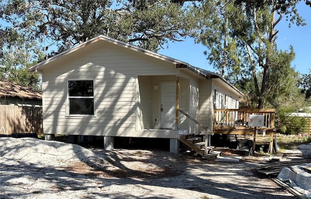 view of home's exterior featuring a deck