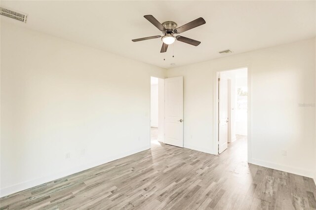 unfurnished room featuring ceiling fan and light wood-type flooring