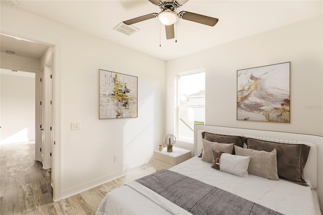 bedroom featuring ceiling fan and light hardwood / wood-style flooring