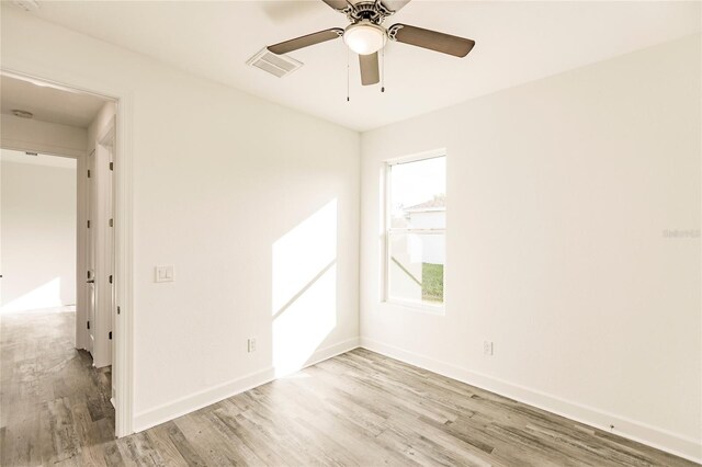 unfurnished room featuring ceiling fan and light hardwood / wood-style flooring