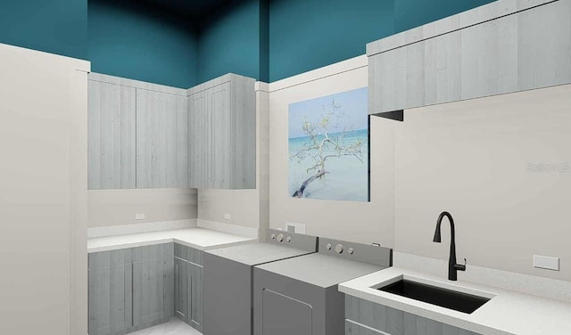 washroom featuring a high ceiling, washer / clothes dryer, and sink