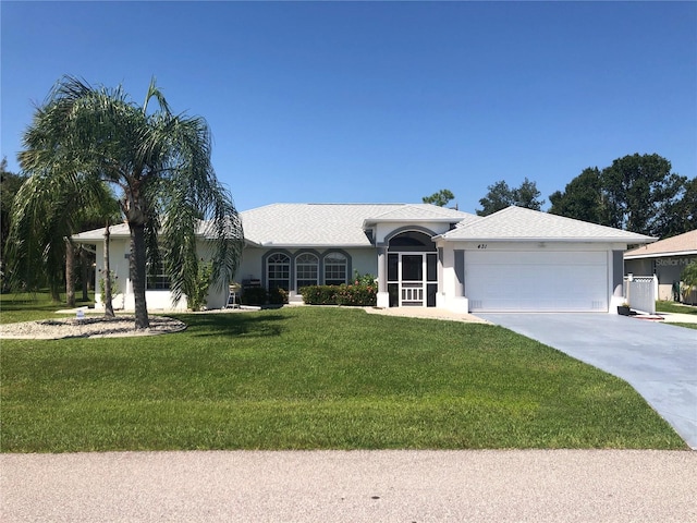 ranch-style home with a front yard and a garage