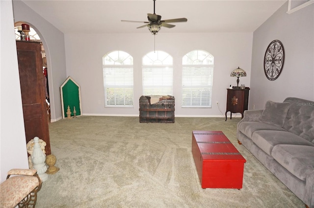 carpeted living room with plenty of natural light and ceiling fan