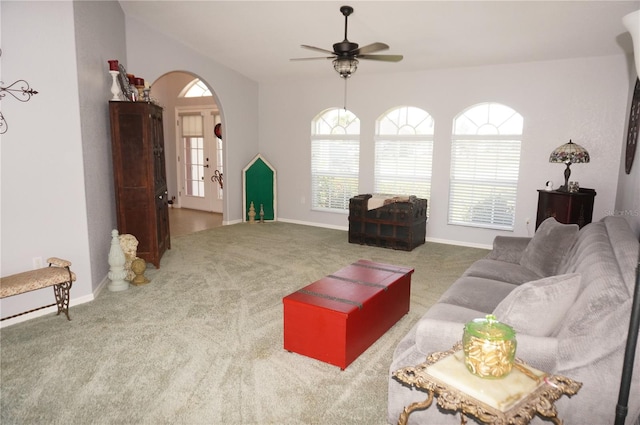 living room featuring carpet and ceiling fan