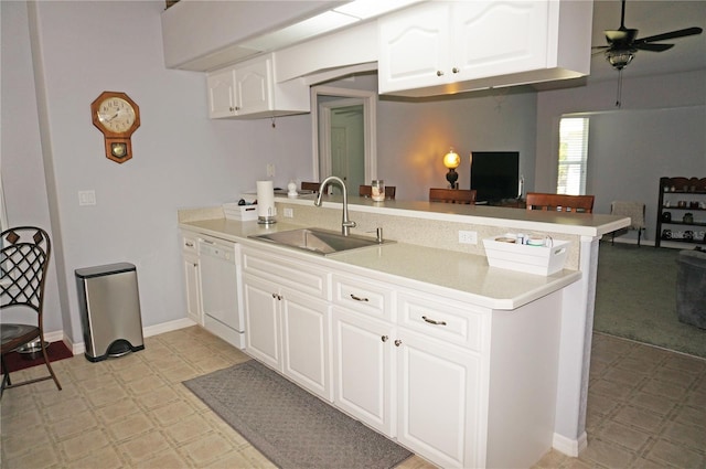 kitchen featuring kitchen peninsula, ceiling fan, sink, light tile floors, and white dishwasher