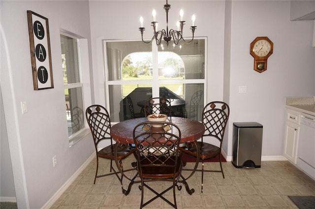 dining room featuring a notable chandelier and light tile floors