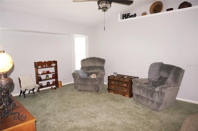 living area with carpet and ceiling fan