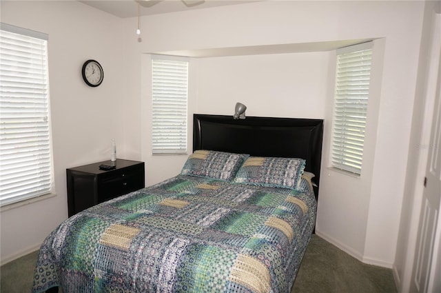 bedroom featuring dark carpet