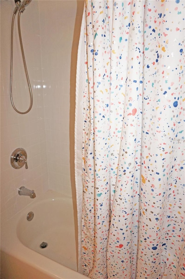 bathroom featuring shower / bath combo with shower curtain