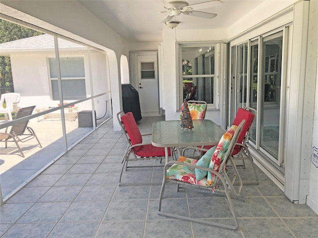 sunroom / solarium with ceiling fan