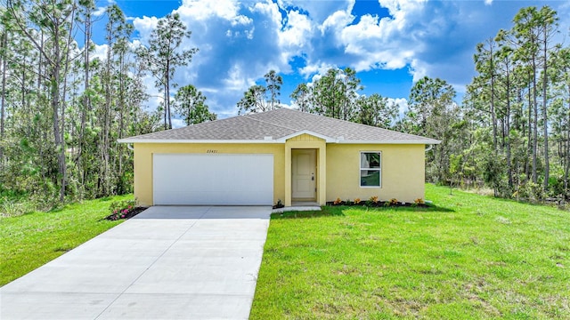 ranch-style house featuring a front yard and a garage