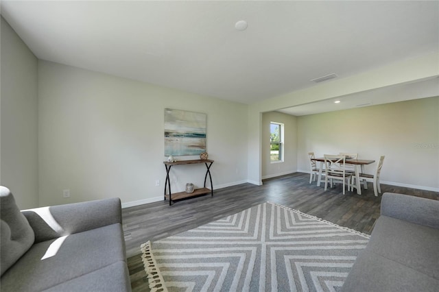 living room featuring dark hardwood / wood-style floors