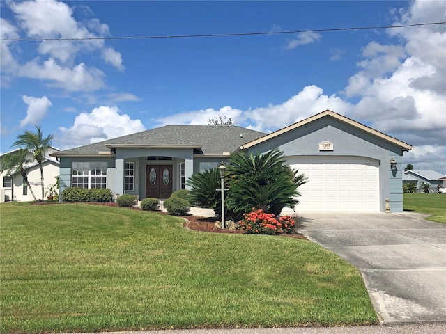 view of front facade with a front yard and a garage